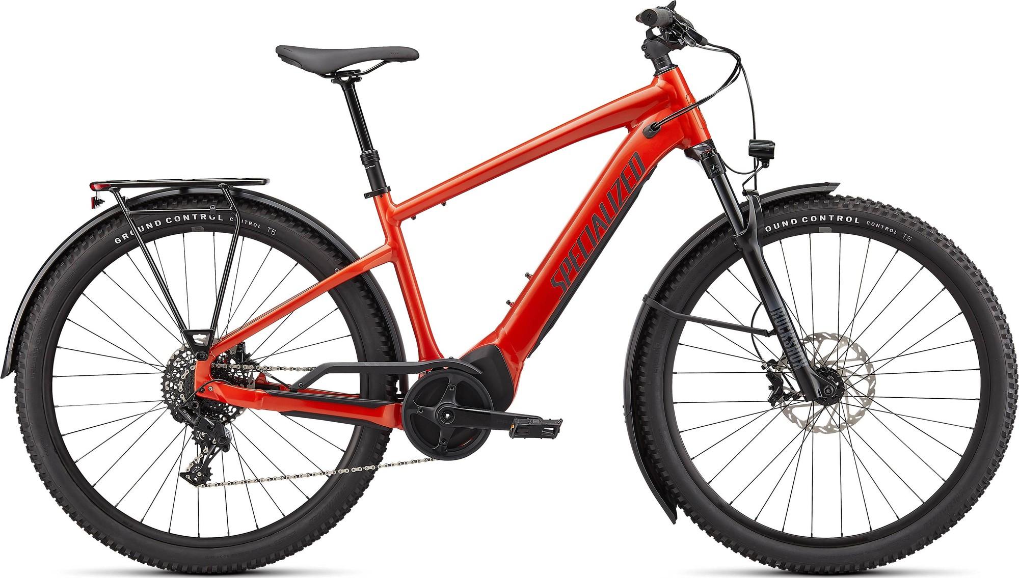 Das Bild zeigt ein rotes Specialized Turbo 4.0, ein vielseitiges e-Bike für die Stadt oder ein Offroad-Abenteuer.