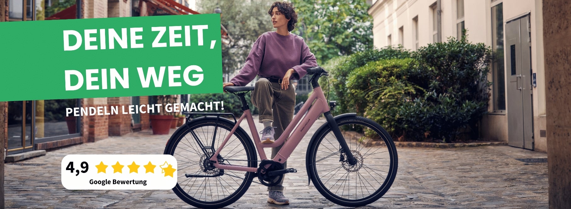 Werbung für E-Bike mit Person auf Kopfsteinpflaster